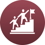 Two people climbing steps toward a flag